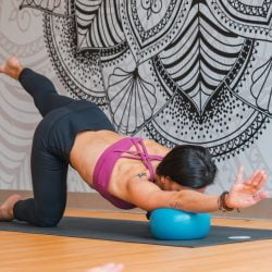 Individual performing Pilates exercise